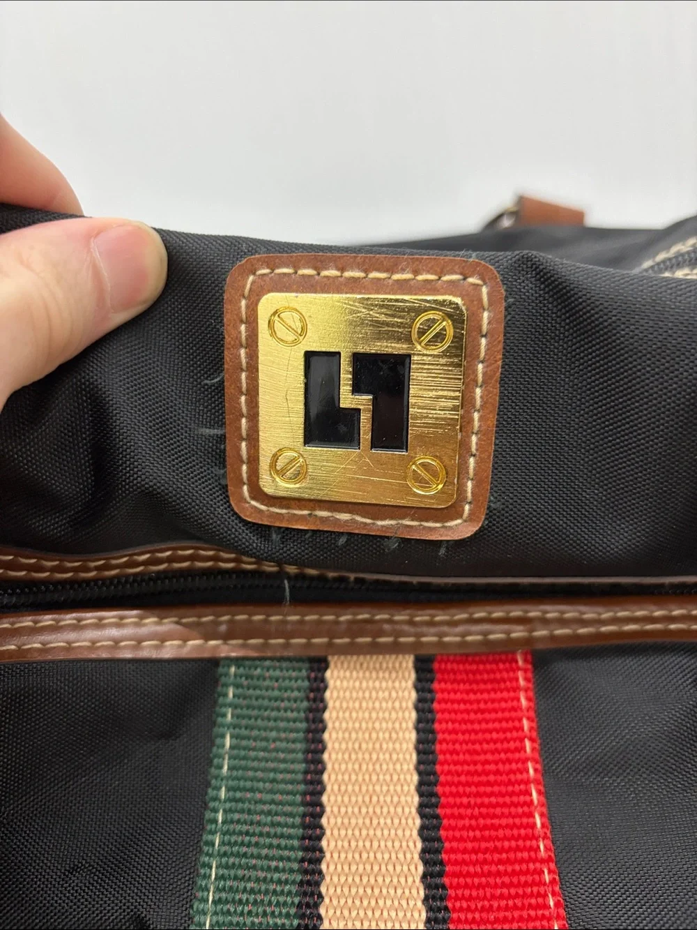 Leisure Black Travel Duffel Bag with Brown Trim and Stripe Accent